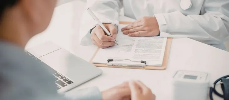 Family medicine physician caring for a patient at VitaleHEALTH